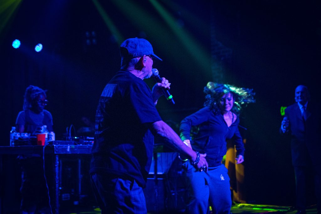 Pete of Pete & Bas shares the stage with the bartender they met earlier in their trip.
